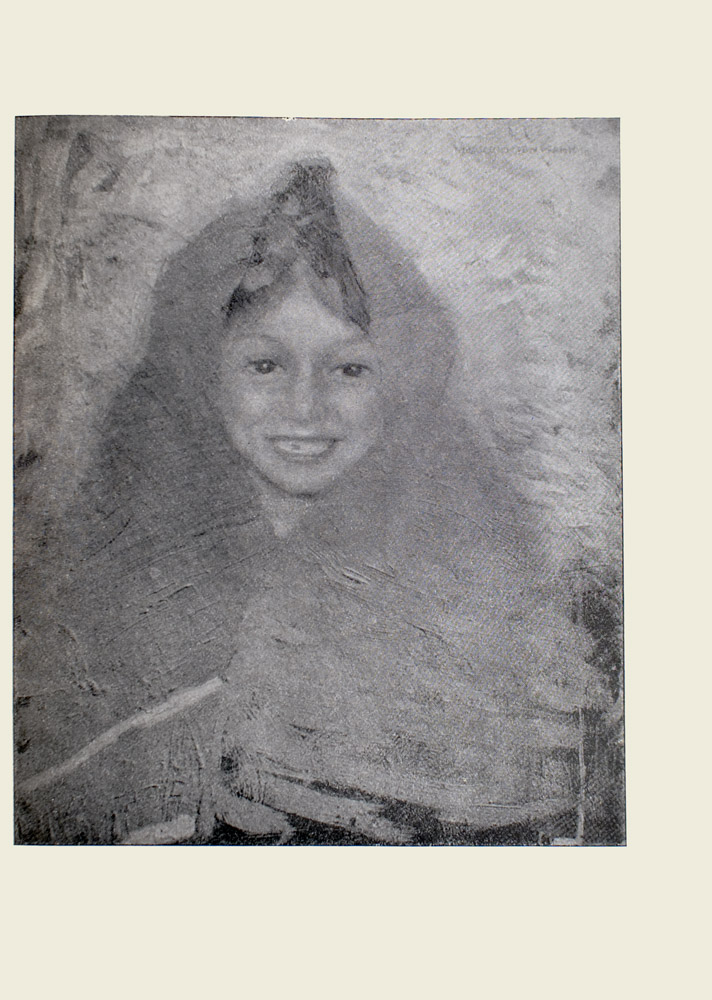 Image is of a young girls head and torso She has dark hair that is tucked under a shawl the part is visible The shawl wraps around her head shoulders and a portion of her chest She is looking forward and smiling The girl has a tooth missing The image is vertically displayed