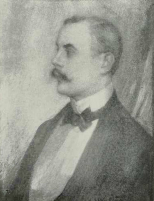 The image is of Kenneth Grahame in profile facing left. He is wearing a dark tuxedo jacket, a white collared shirt and a dark bowtie. He also has a moustache. The image is vertically displayed.