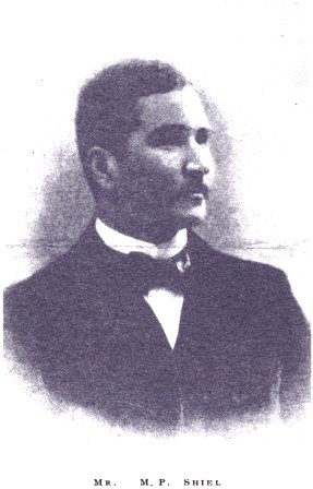 Image is of M.P. Shiel shown from the shoulders up with ¾ face. He is looking to the right. He is wearing formal dress with a bow tie. The background is open and light coloured.